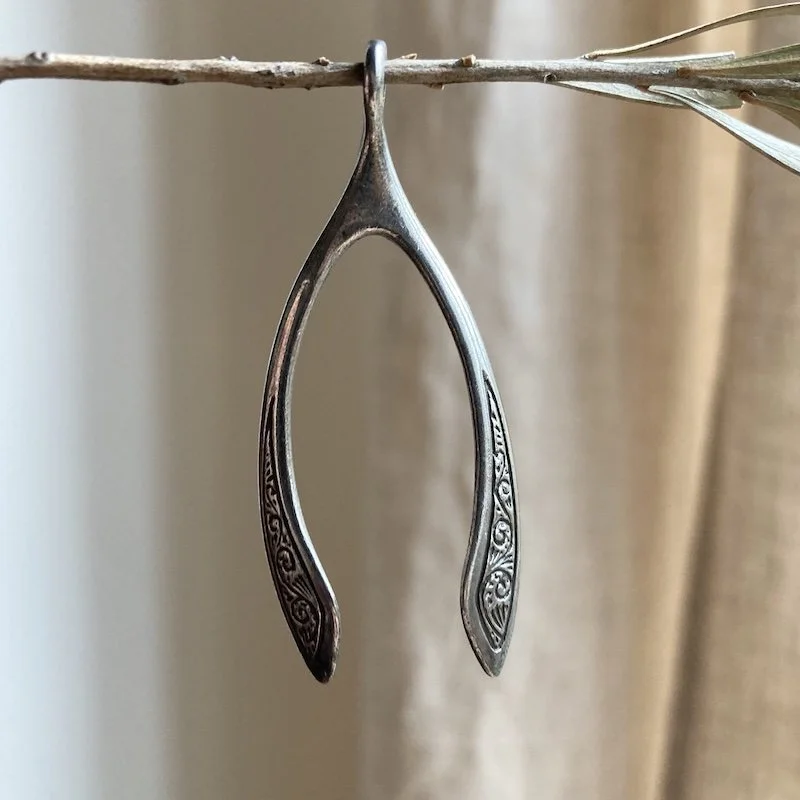 large ornate sterling silver wishbone pendant.jpeg
