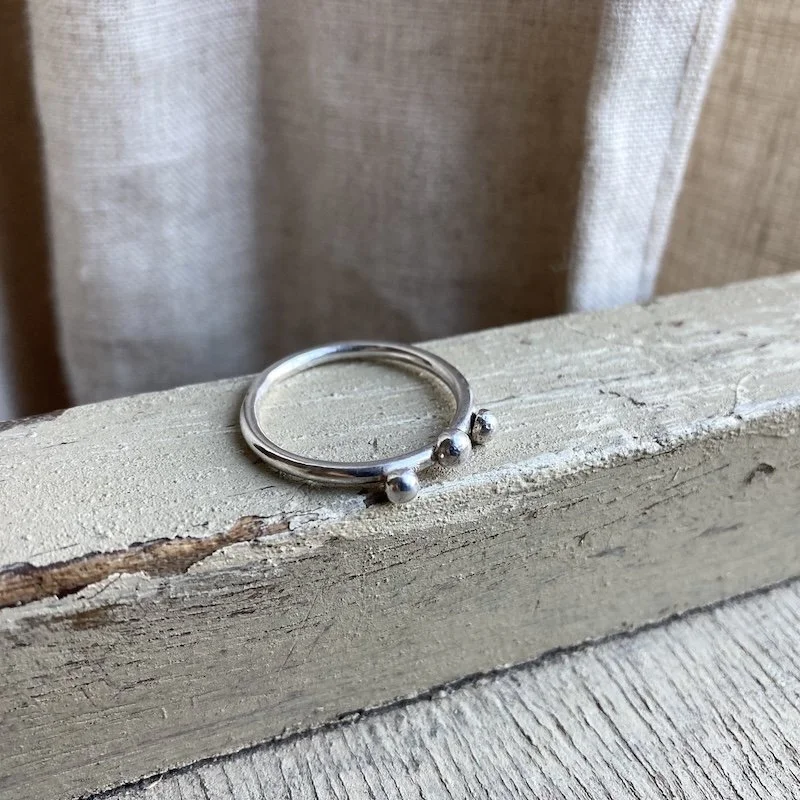 simple sterling silver dot band ring.jpeg