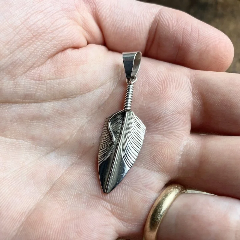 Southwestern sterling silver feather pendant .jpeg