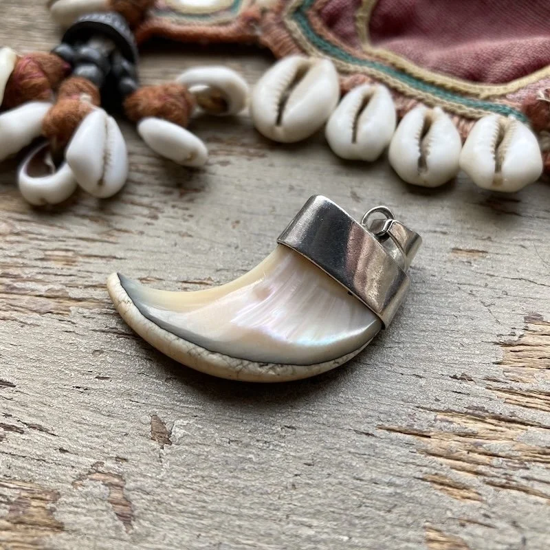 vintage sterling silver shell claw pendant.jpeg
