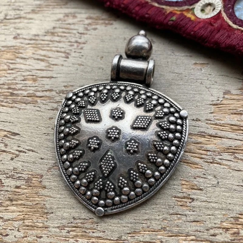 Indian ornate solid silver pendant.jpeg