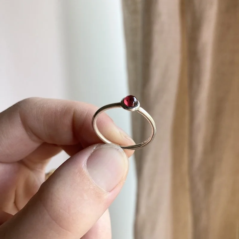 cute little sterling silver garnet cabochon ring 2.jpeg