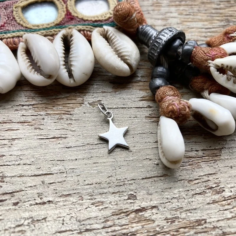 tiny little sterling silver star pendant 1.jpeg