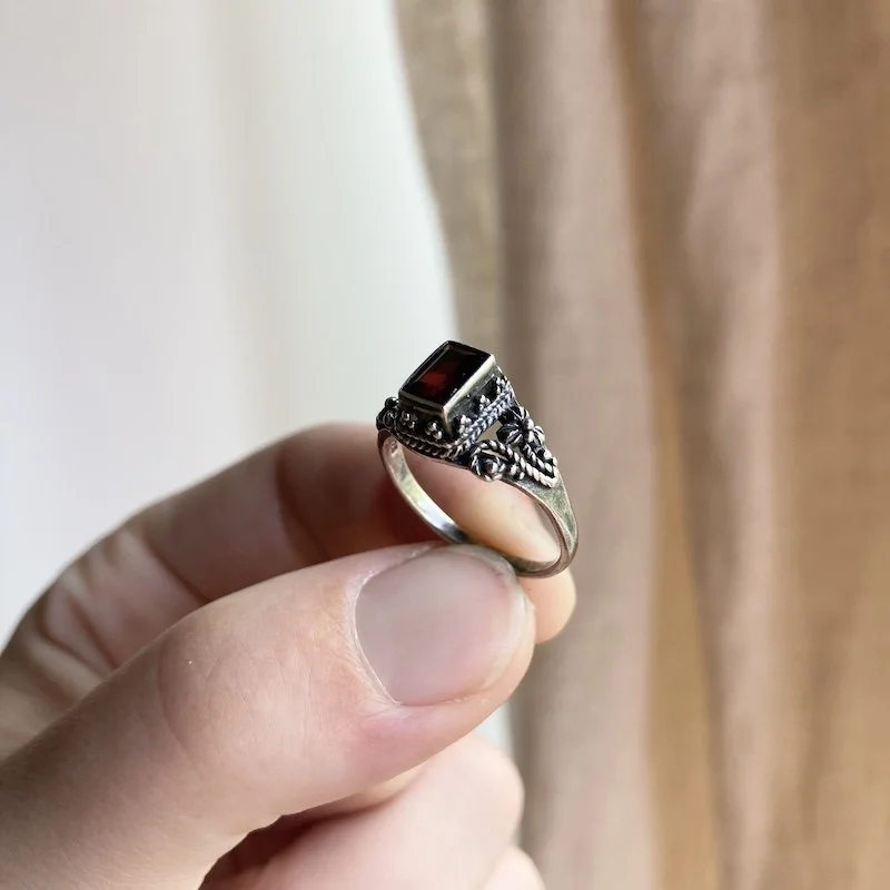 ornate sterling silver and garnet ring 2.jpeg