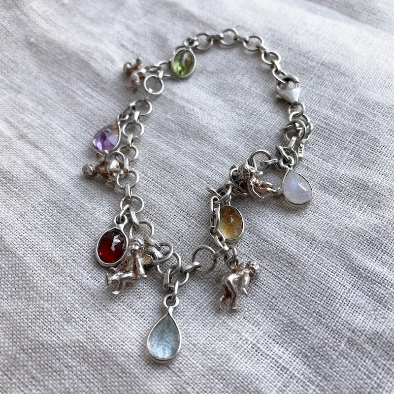 vintage sterling silver cherub crystal bracelet.jpeg