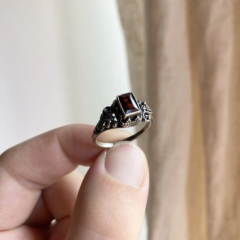 ornate sterling silver and garnet ring 1.jpeg