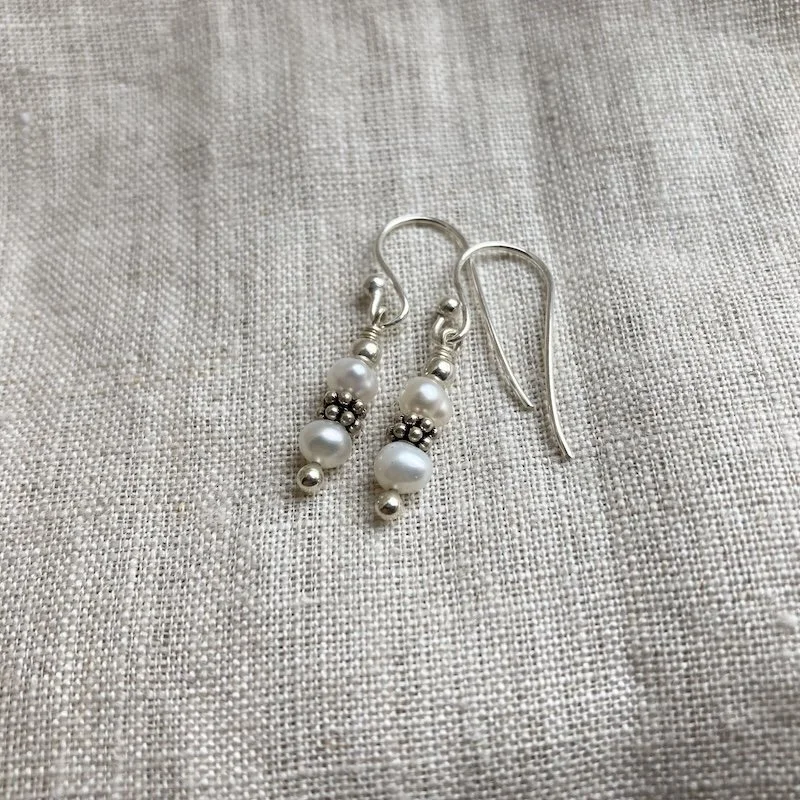 dainty sterling silver pearl earrings.jpeg