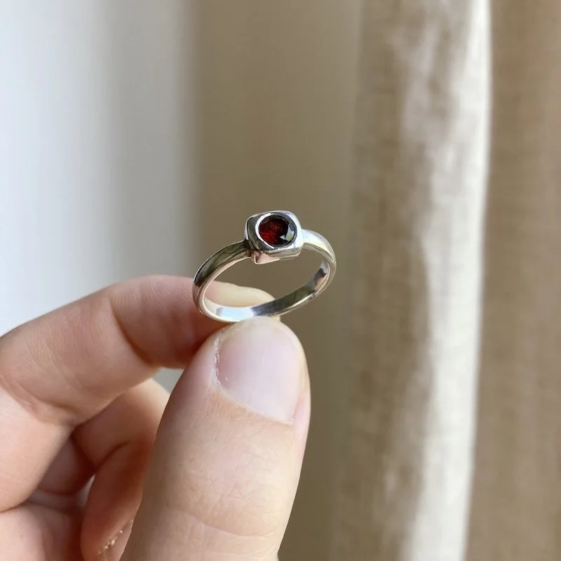 simple sterling silver and garnet ring 2.jpeg