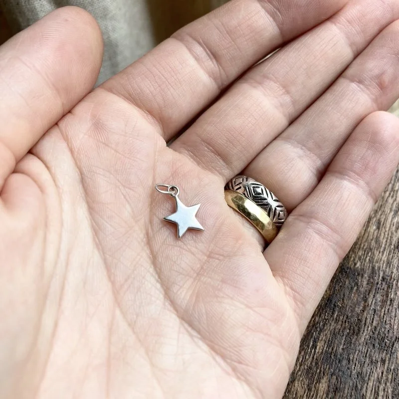 tiny little sterling silver star pendant 3.jpeg