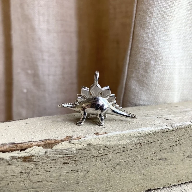 solid silver Stegosaurus pendant 1.jpeg