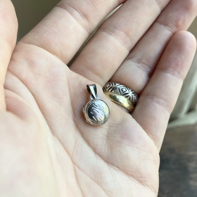 tiny round sterling silver locket 4.jpeg