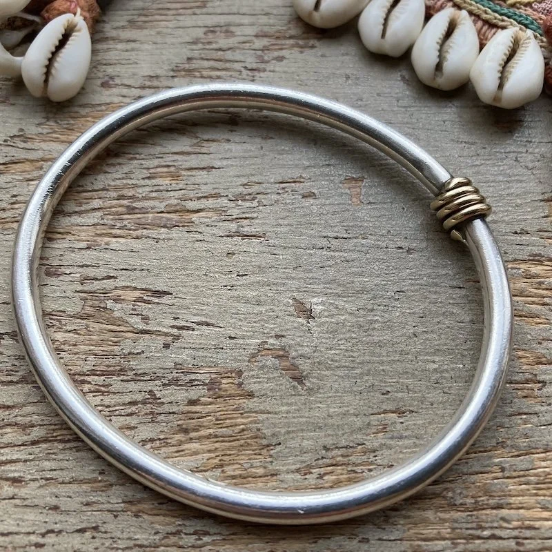 minimalist sterling silver bangle with gold-plated detail .jpeg