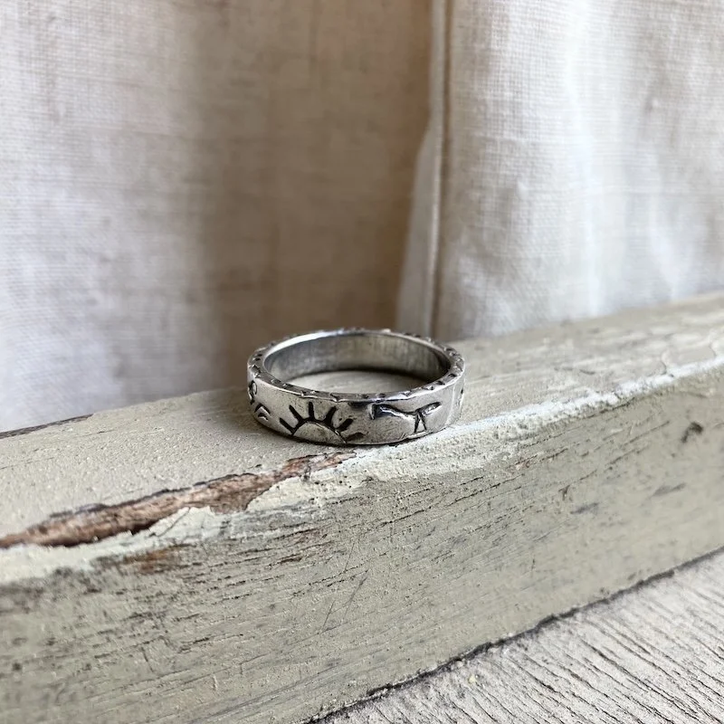Southwestern sterling silver sun and animal ring 2.jpeg