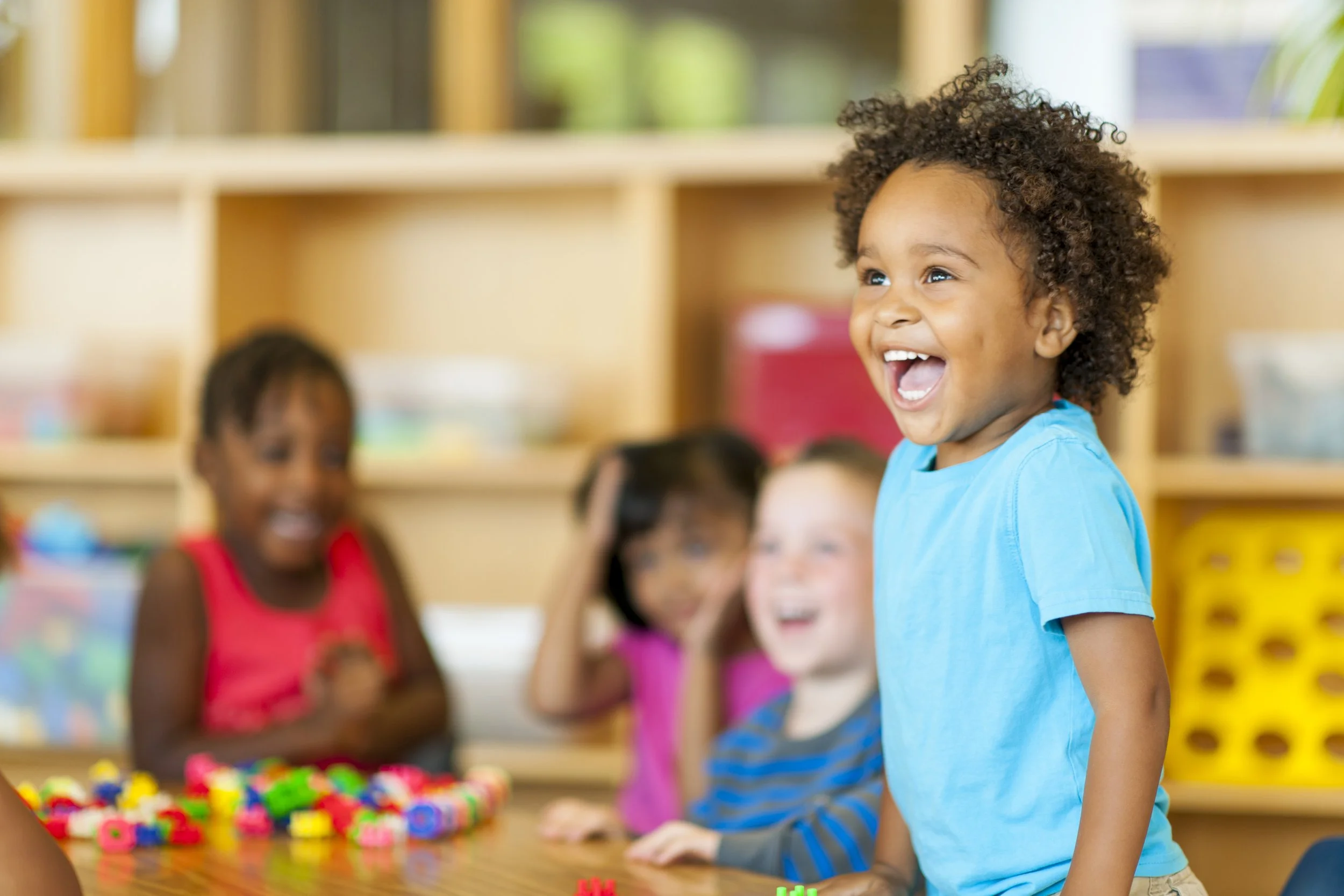four and five year old happy at daycare center