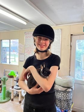 Student holding rabbit
