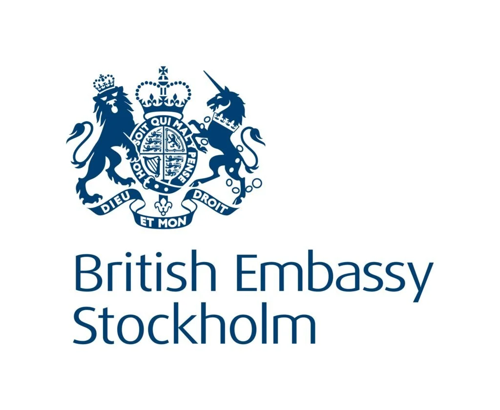 Logo of the British Embassy in Stockholm featuring the Royal Coat of Arms above the text 'British Embassy Stockholm' in blue.