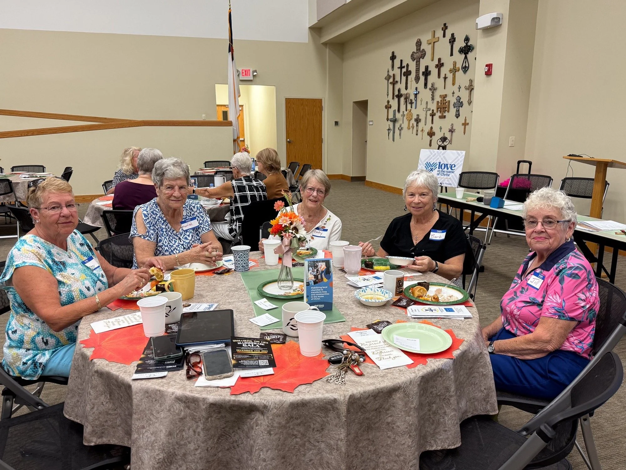 Women of Presbyterian Women talking around a lunch table