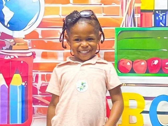 A smiling Little Blessings student on the first day of school