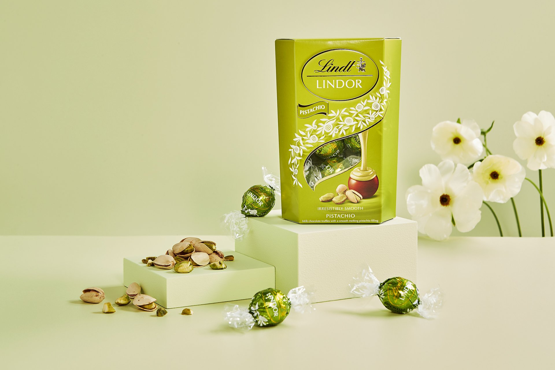 Pistachio Lindor truffle on plinths