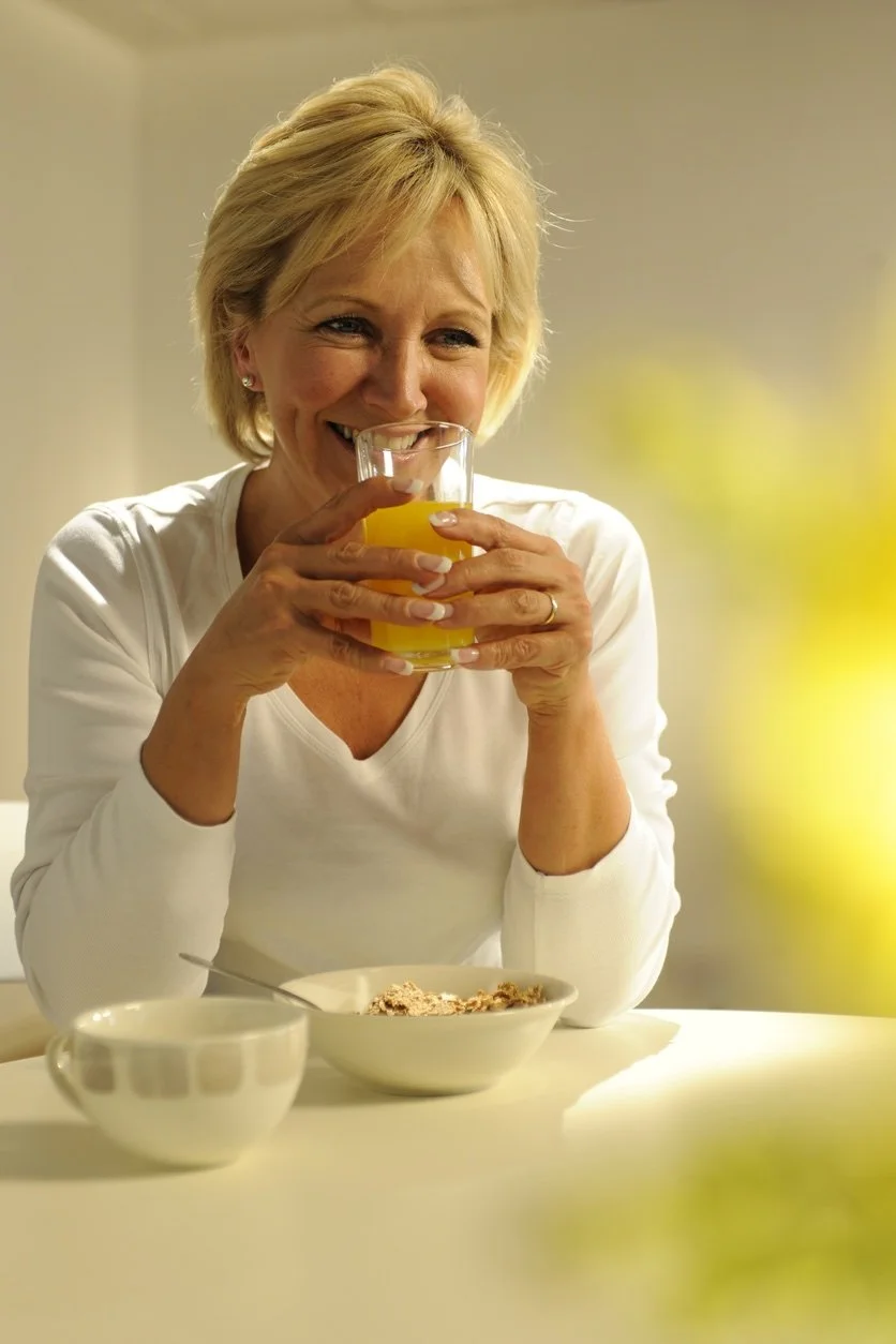 Louisa Hedley sipping an orange juice at  at breakfast