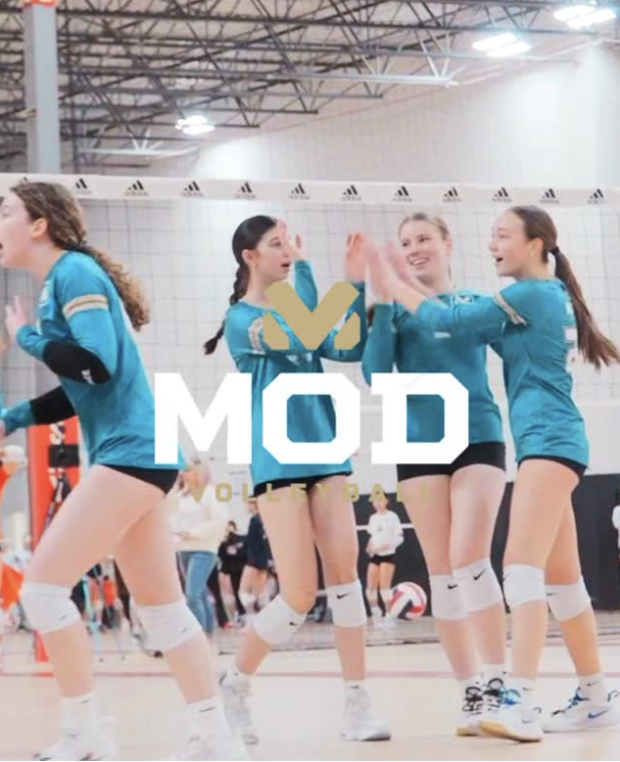 MOD volleyball team celebrating.