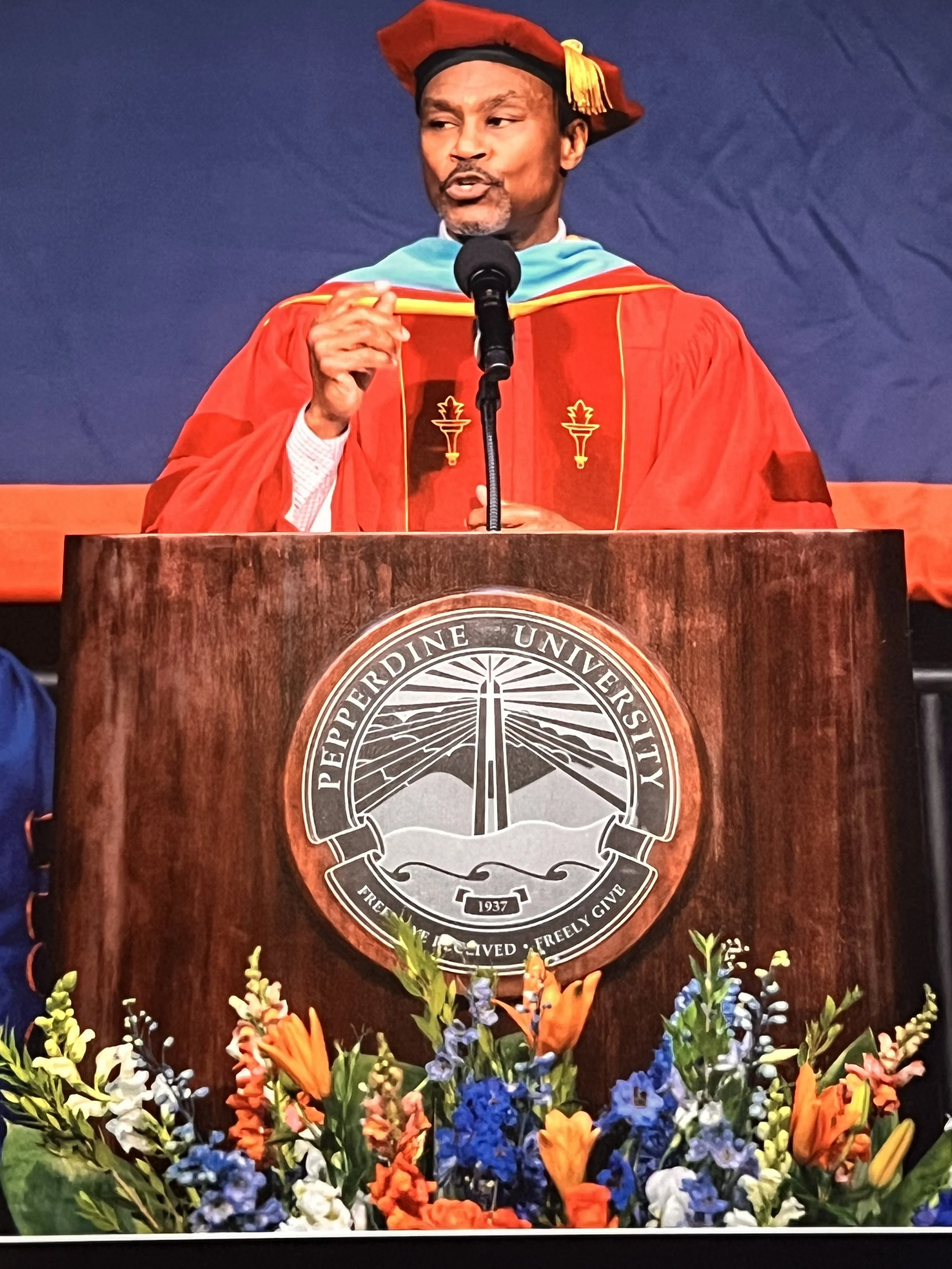 Keith Dorsey in doctoral regalia delivering the Pepperdine Graziadio commencement keynote