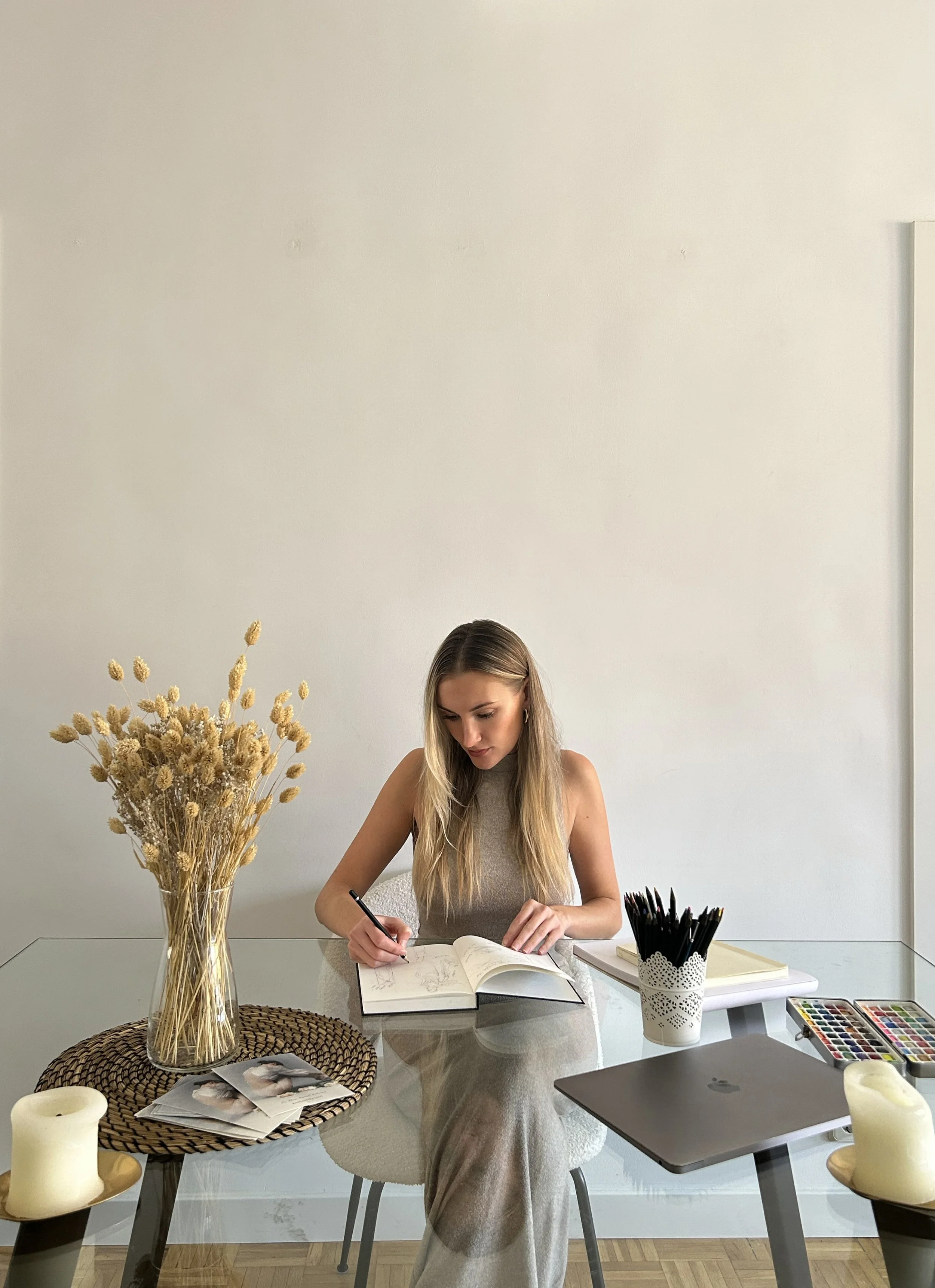 Kassandra Liot sketching couture designs at her atelier in Madrid