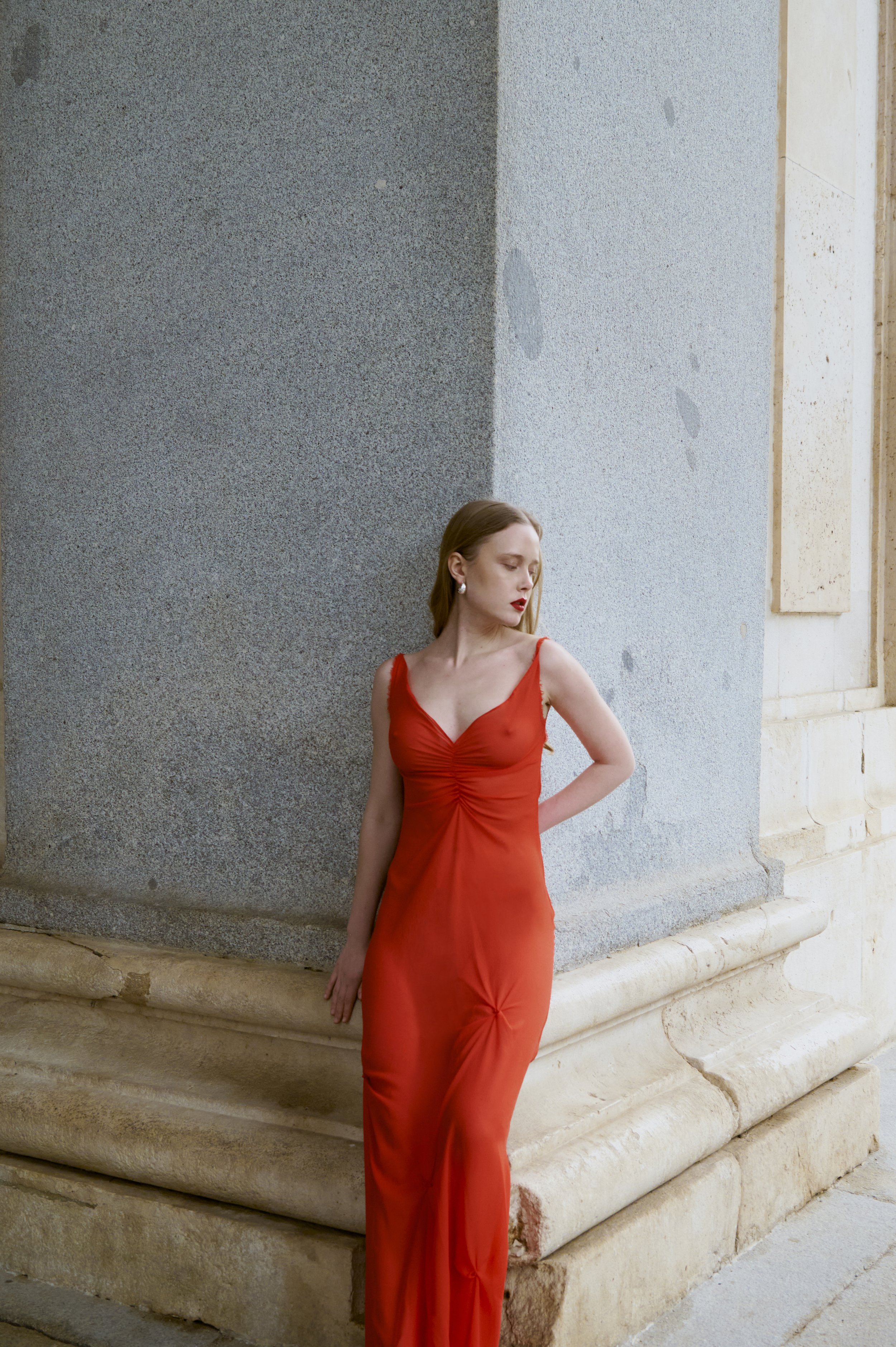 Red silk georgette dress with fluid drape, sculptural couture silhouette