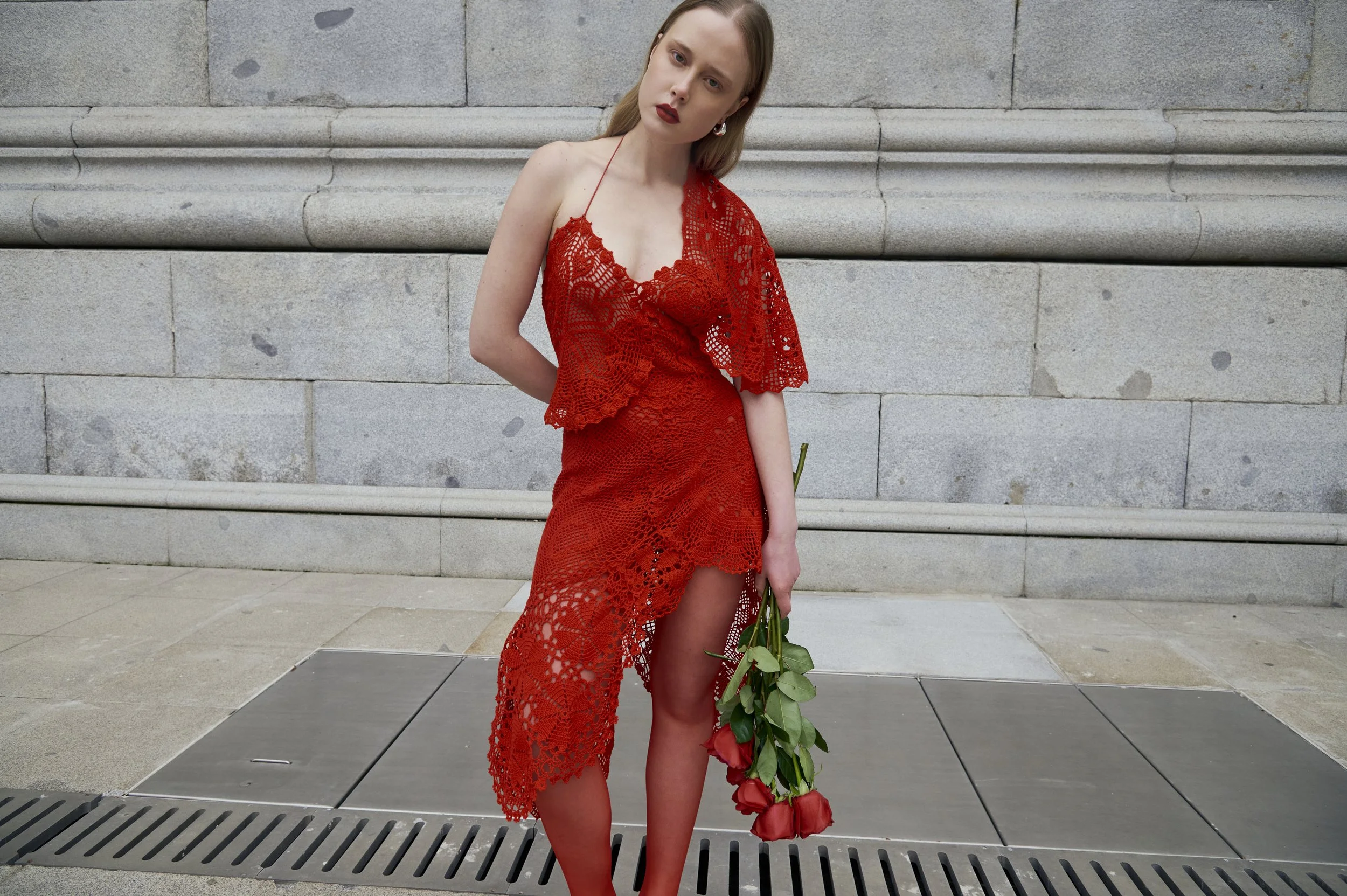 Asymmetrical red crochet dress with handcrafted and sculptural lines