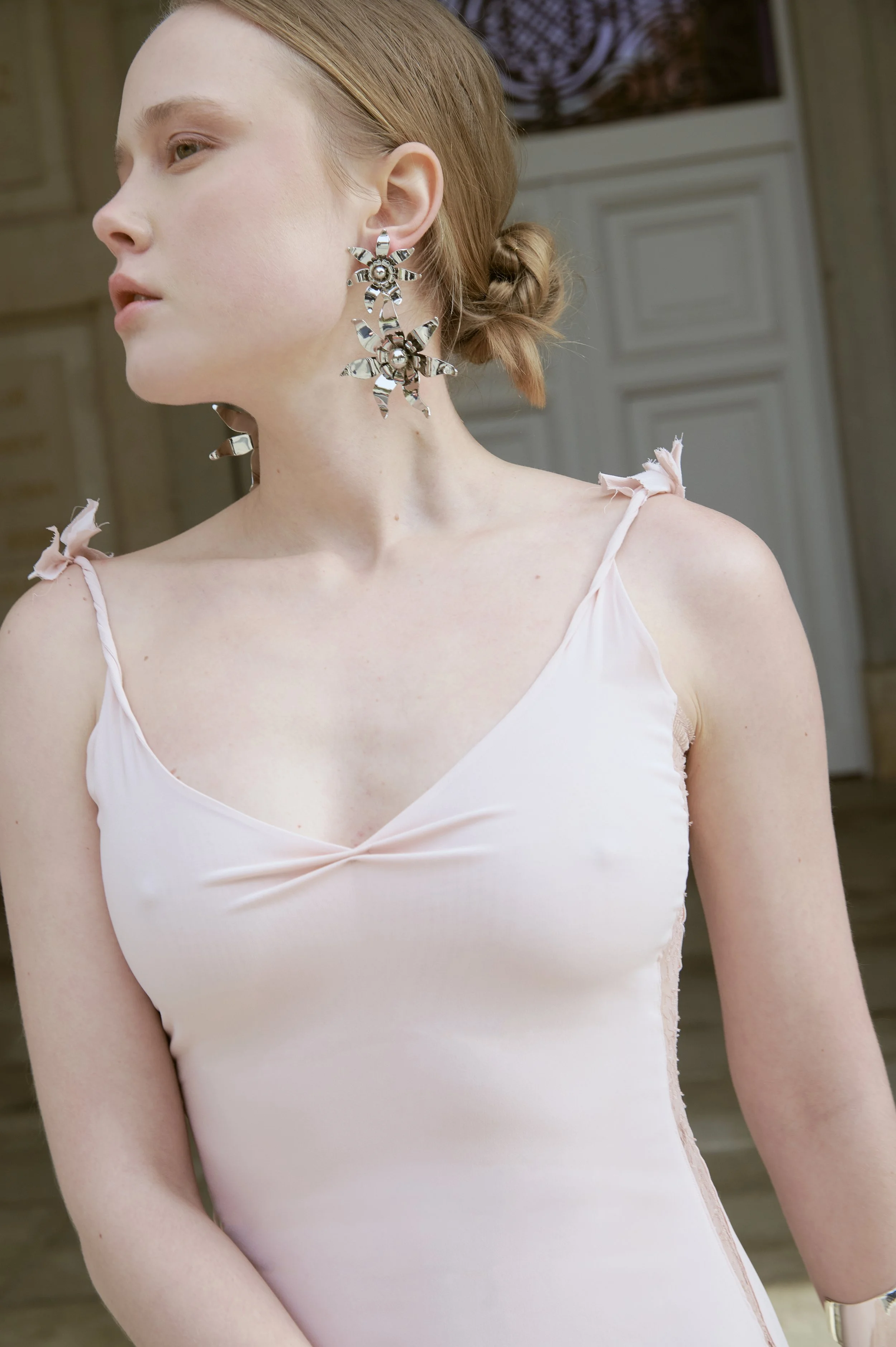 Blush silk slip dress with delicate straps and refined couture silhouette