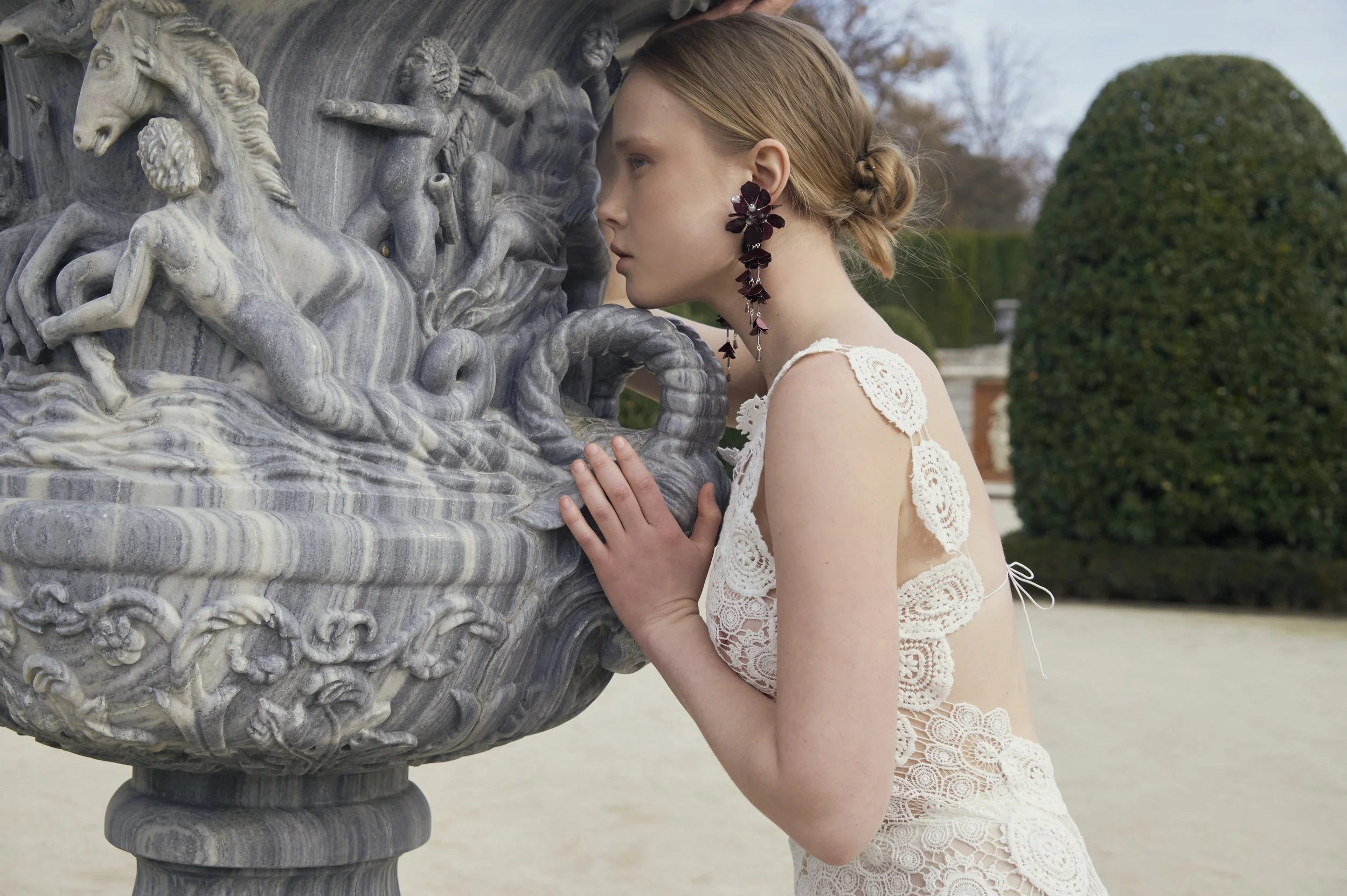 Sculptural white crochet dress with artisanal circular motifs