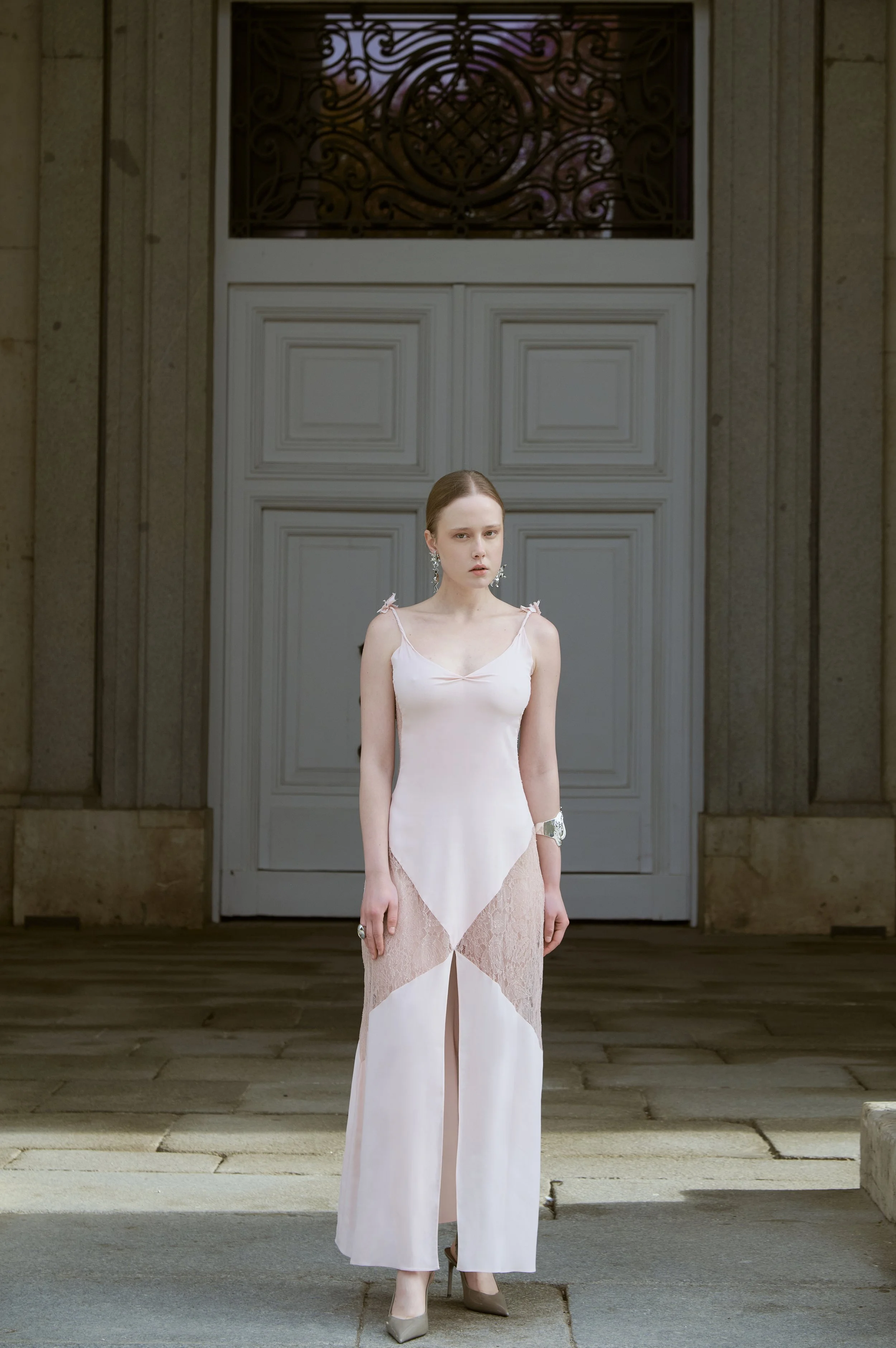 Powder pink silk slip dress with delicate straps and refined couture silhouette