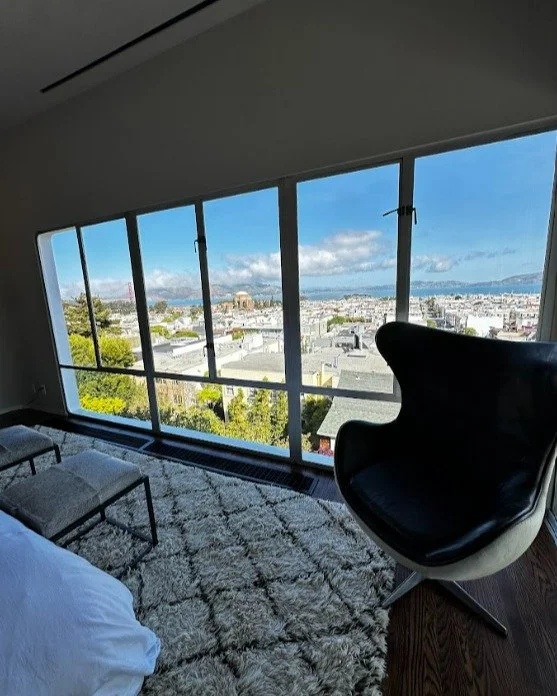 Wake up to panoramic city views and endless natural light ✨
This stunning modern bedroom features floor-to-ceiling windows, sleek finishes, and a front-row seat to the skyline&mdash;perfect for those who crave comfort, style, and breathtaking scenery
