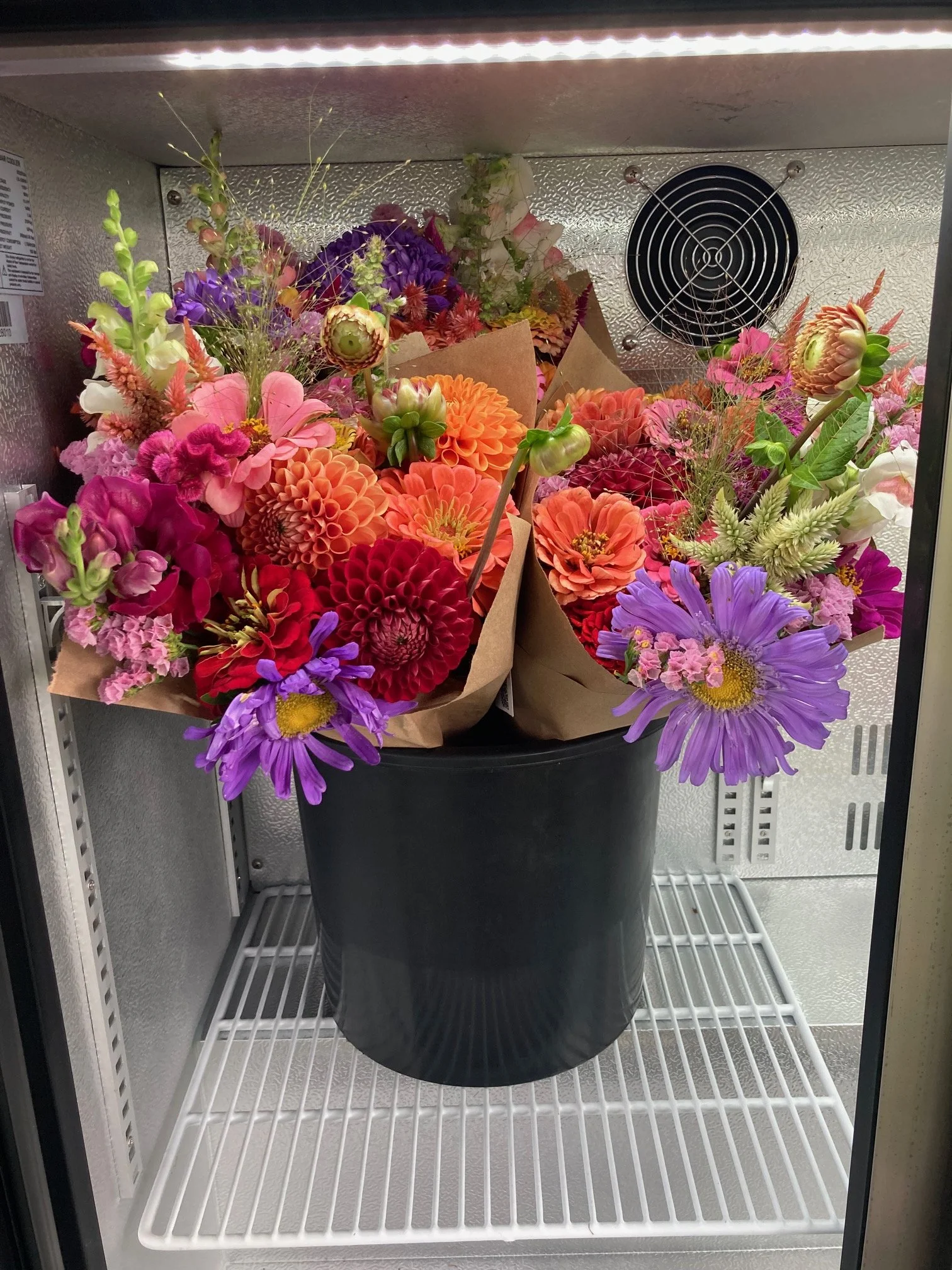 wrapped bouquets in the cooler