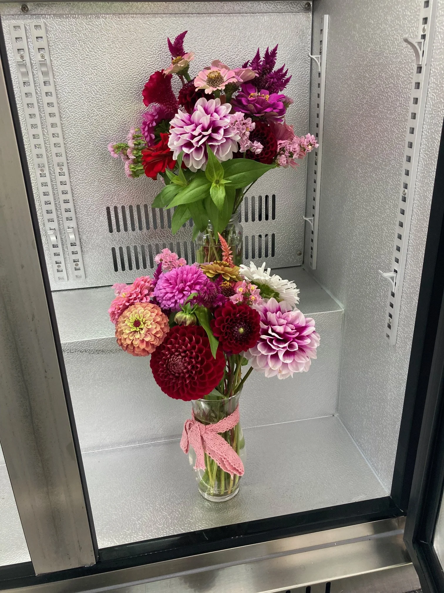 vase arrangements in the cooler