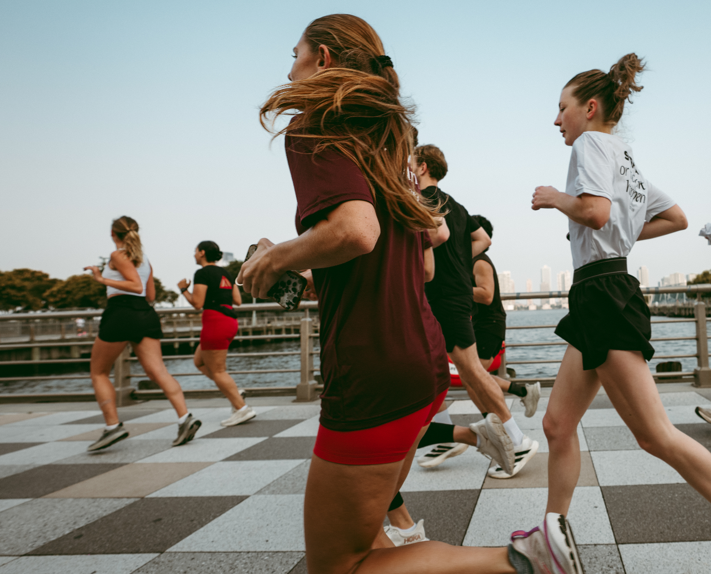 Women run together a a run club