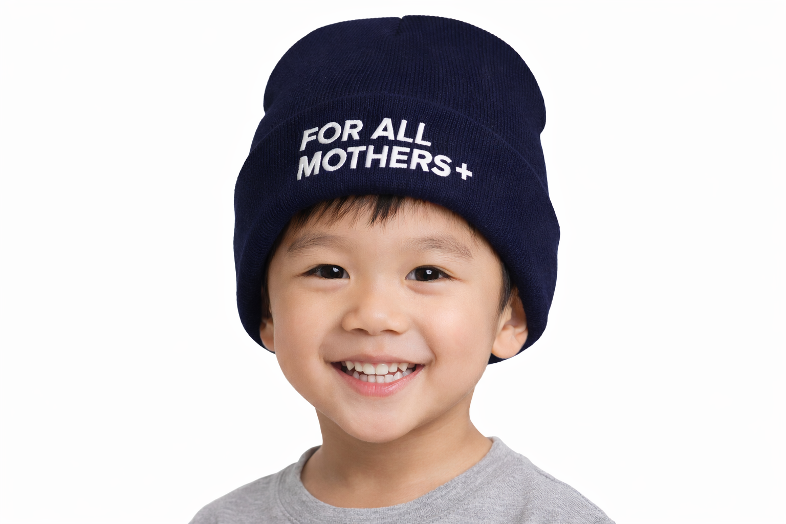 Smiling boy in navy For All Mothers+ beanie
