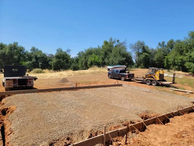 Construction site in Redding, CA with new concrete foundation by Fishers Decorative Concrete service