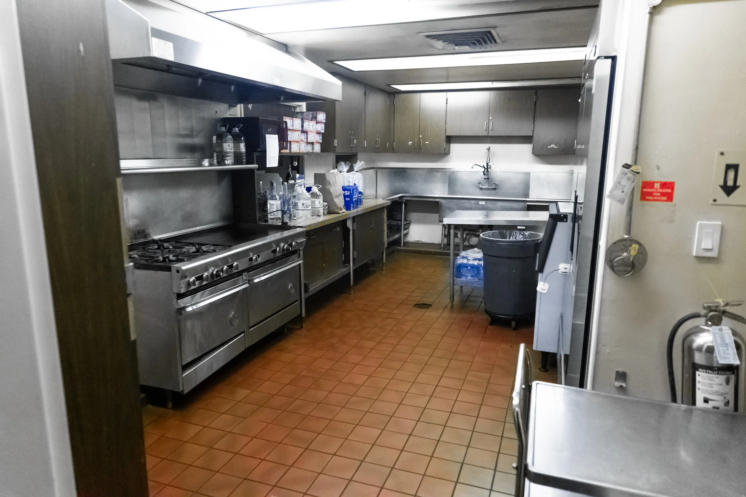kitchen-with-stove-oven-fridge-ice-machine-sinks-trash-cans-prep-area-the-abg-fresno-the-abg-event-venue.jpg