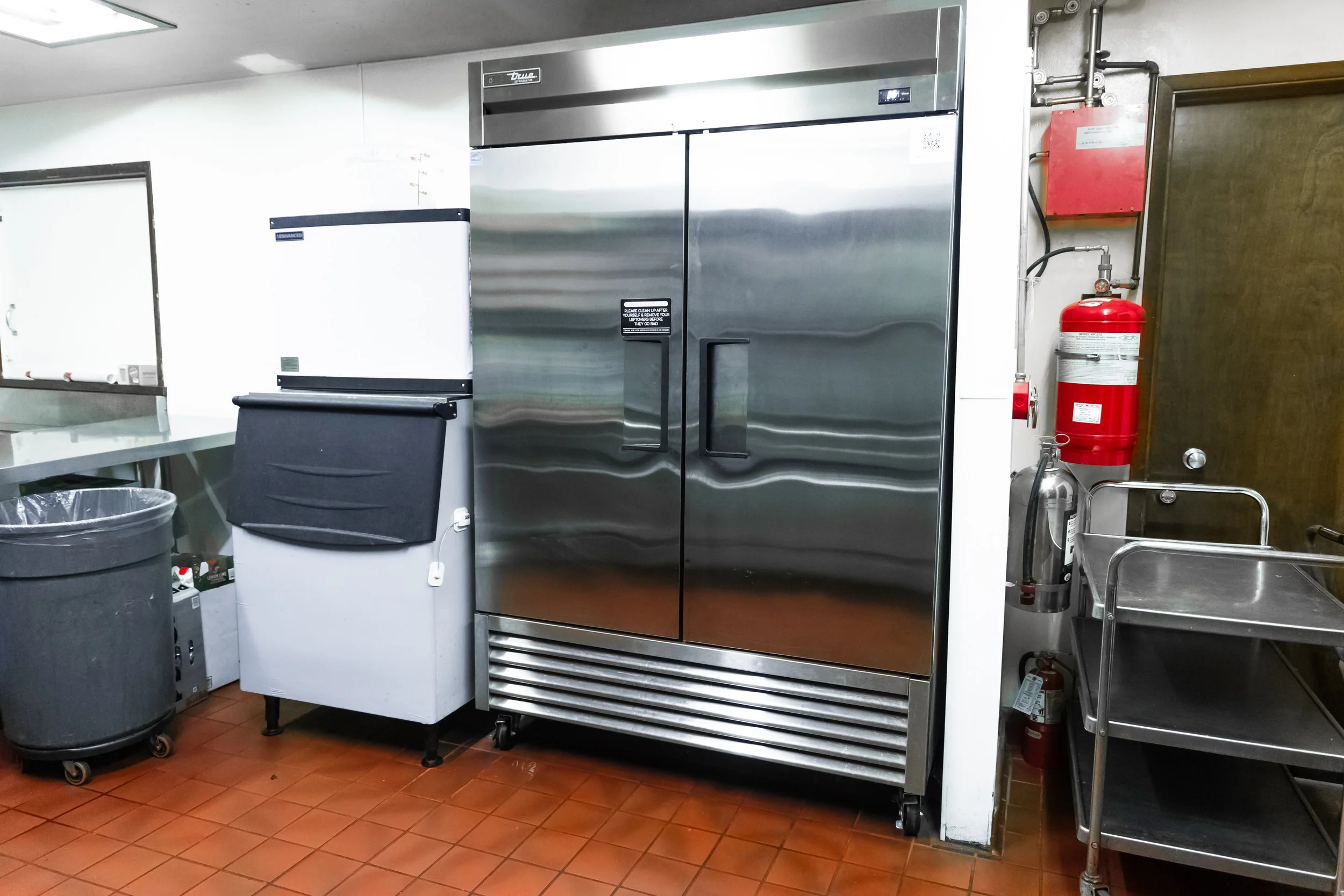 ice-machine-and-refridgerator-kitchen-with-stove-oven-fridge-ice-machine-sinks-trash-cans-prep-area-the-abg-fresno-the-abg-event-venue.jpg
