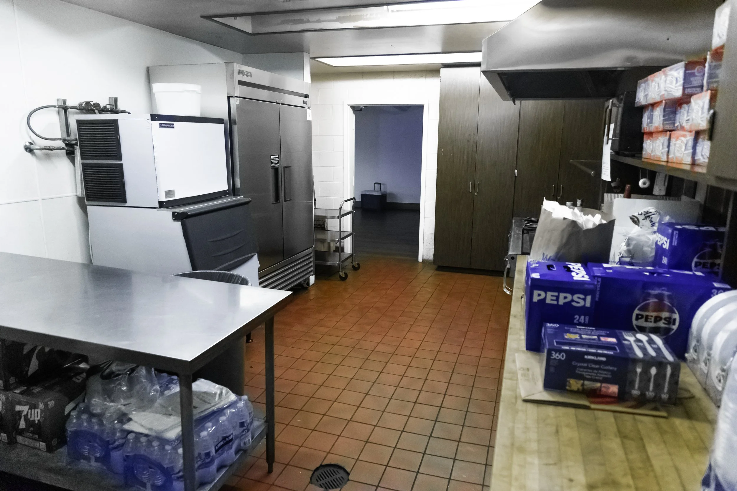 view-from-sink-kitchen-with-stove-oven-fridge-ice-machine-sinks-trash-cans-prep-area-the-abg-fresno-the-abg-event-venue.jpg