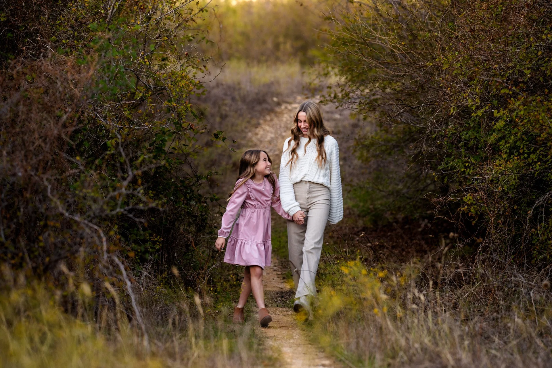 Color-photo-of-two-sisters-walking-on-a-trail-in-Texas-by-Sunny-Mays.jpg