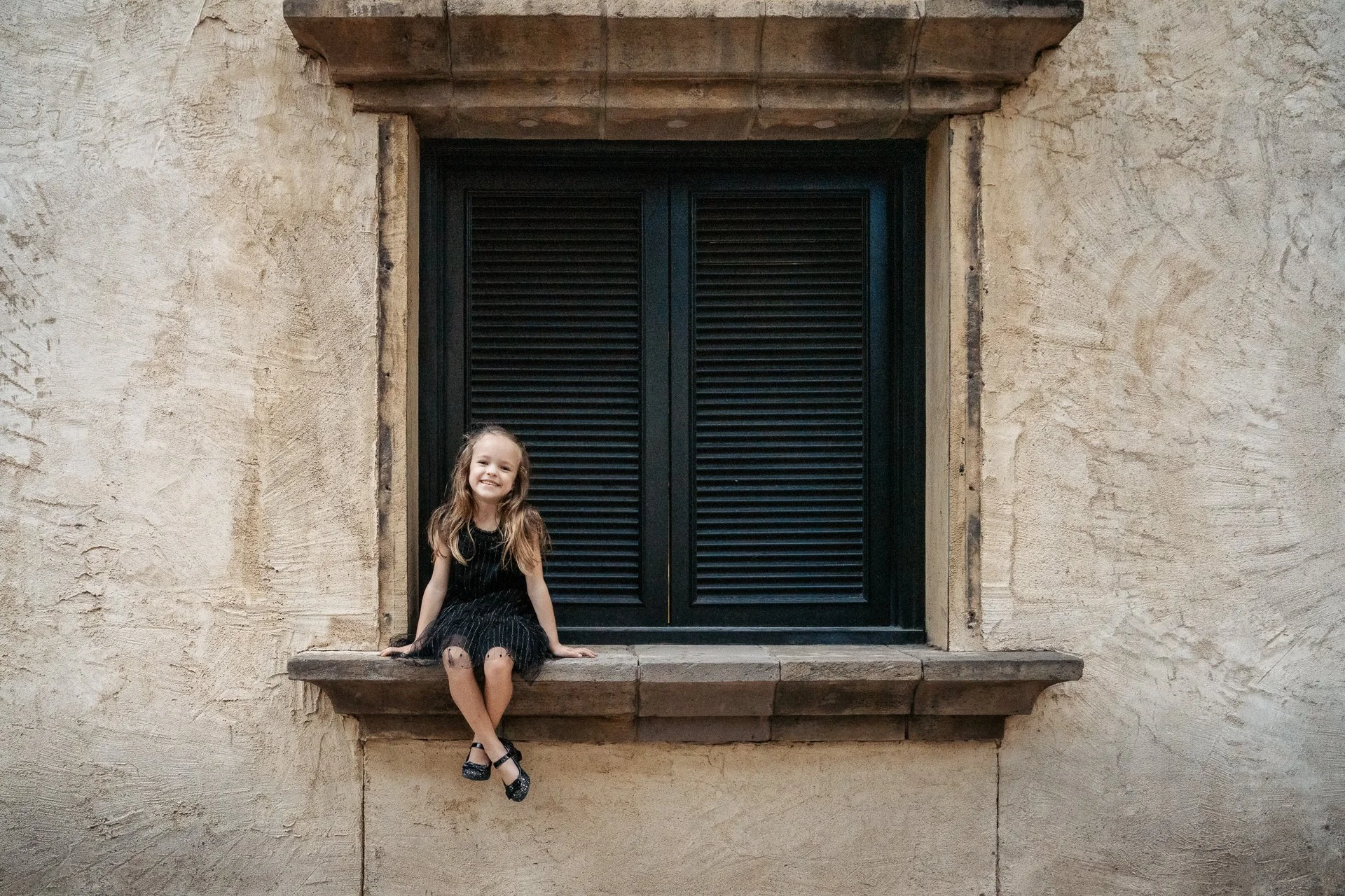 Color-photograph-of-a-girl-sitting-on-a-window-sill-near-Dallas-Texas.jpg