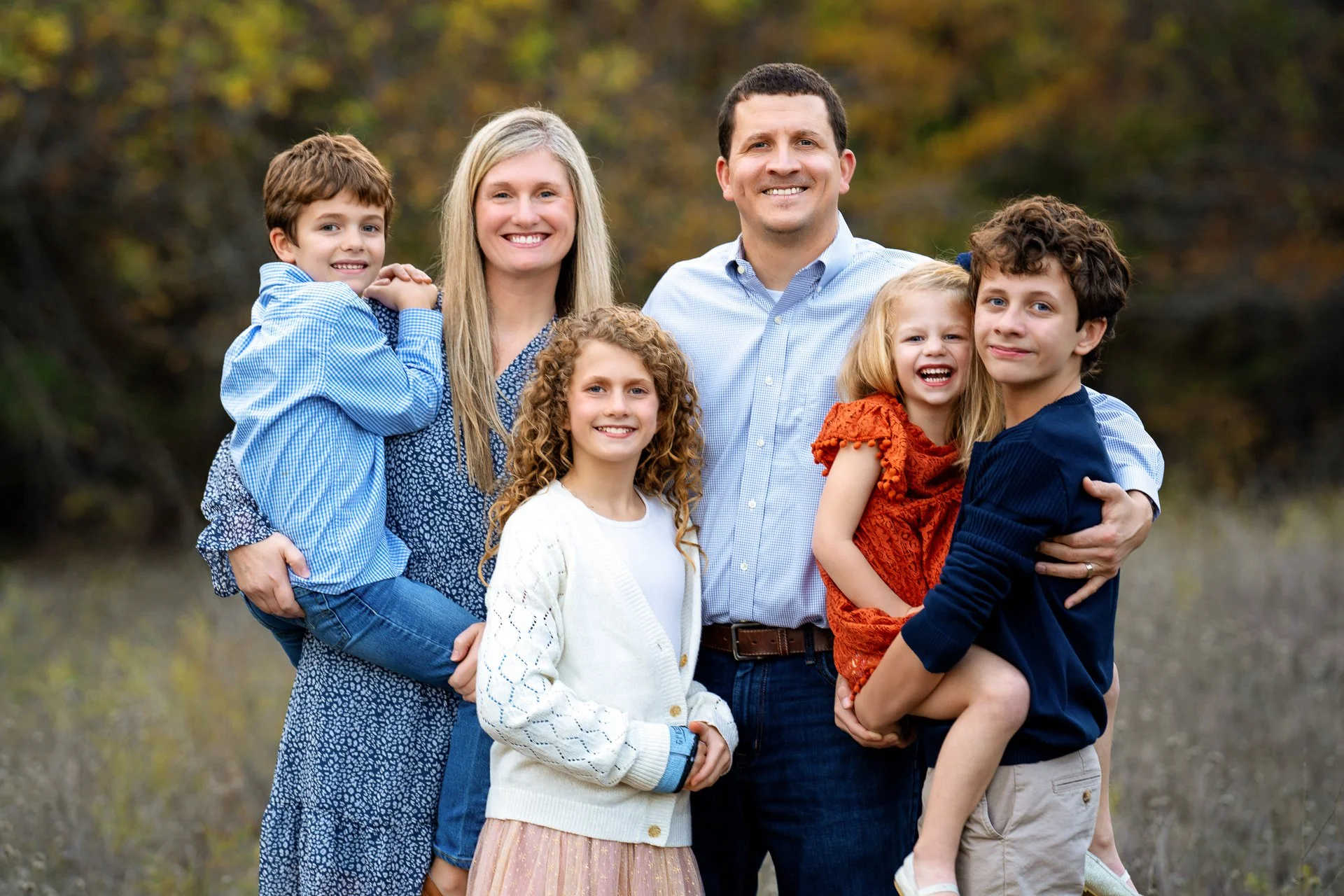 Family-standing-in-a-field-near-Trophy-Club-Texas.jpg
