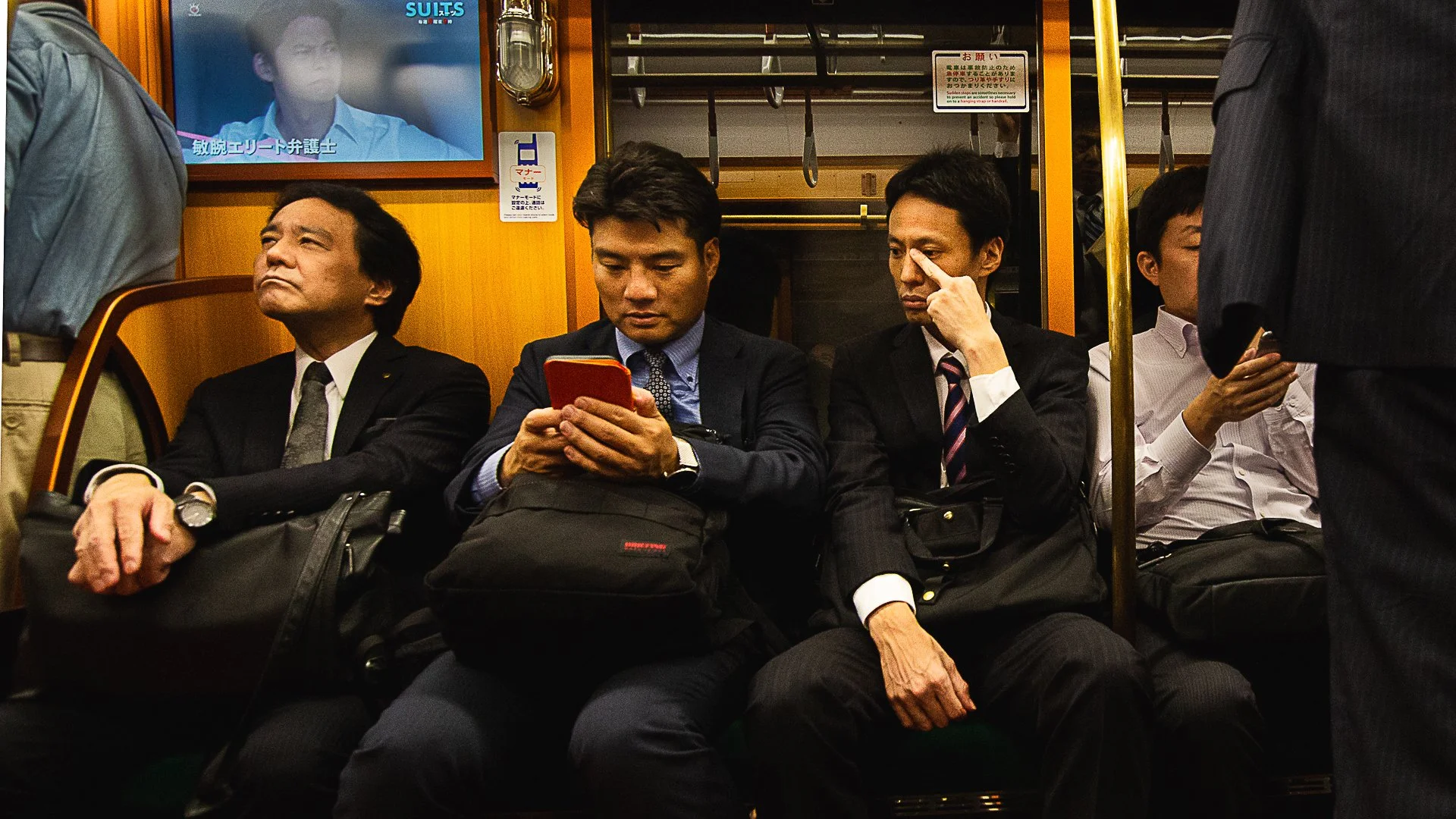 funny-colorful-image-of-men-on-a-train-in-Japan.jpg