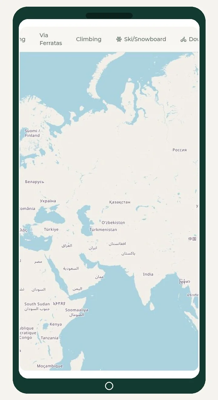 A digital map of Eurasia and Africa on a tablet screen showing country names and various activity icons such as climbing, skiing, and cycling.
