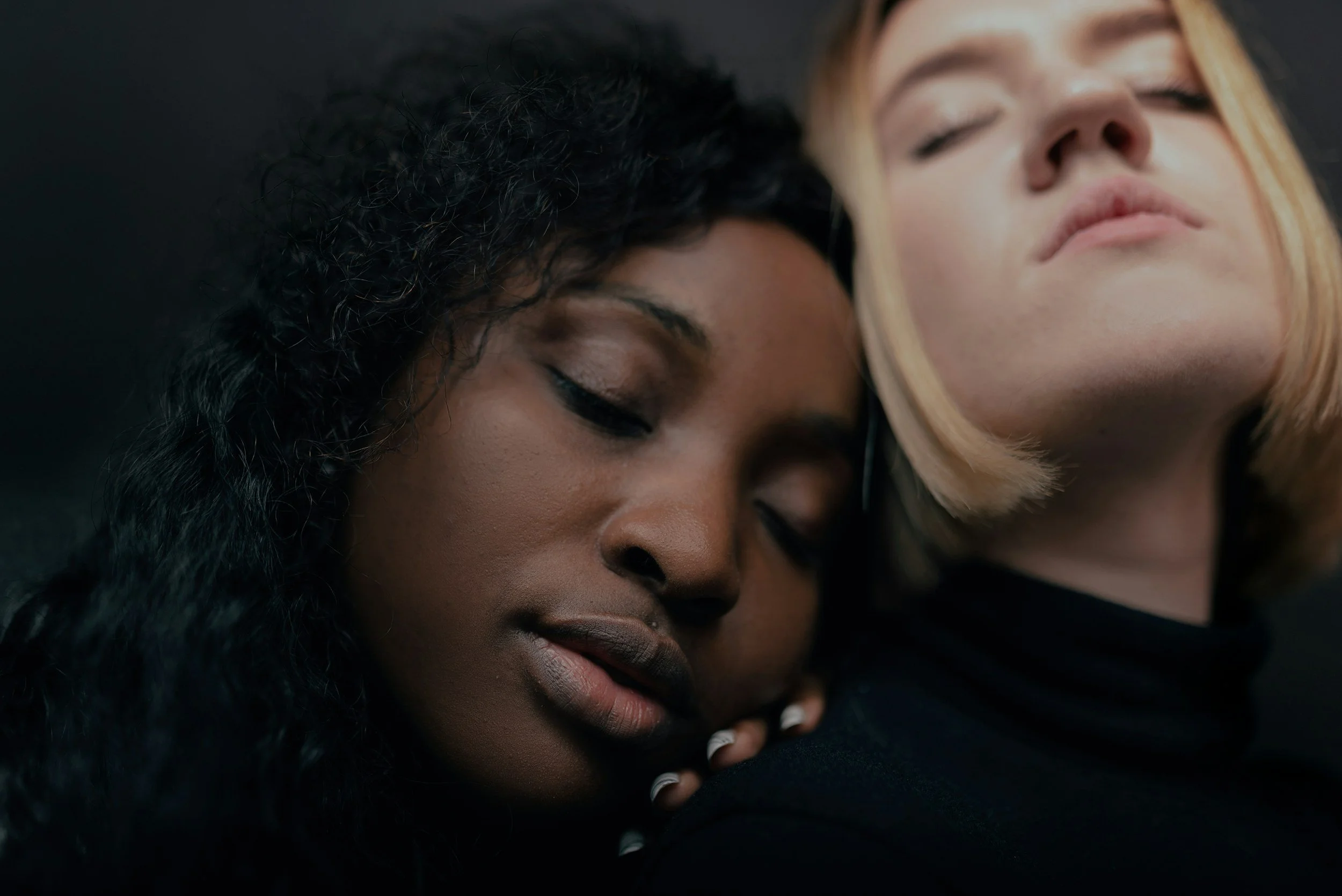 Two people sitting together in peaceful silence, showing how presence and listening support healing for sexual assault survivors.