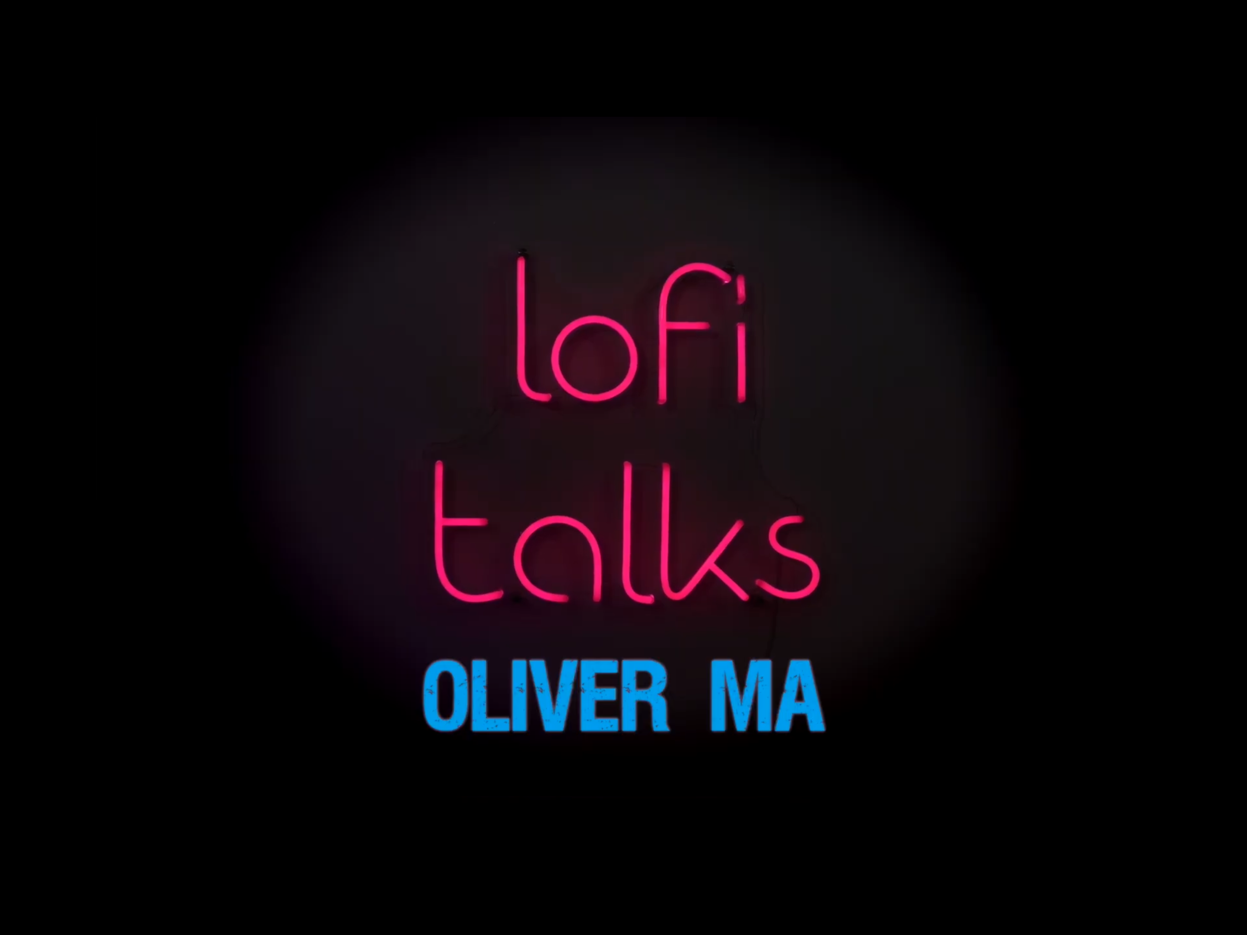 Neon sign reading 'Lofi Talks' in pink and 'Oliver MA' in blue on a black background.
