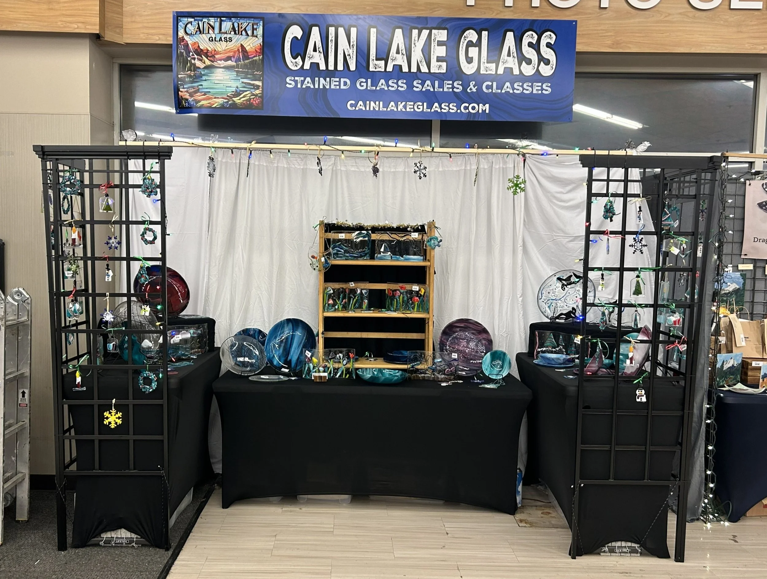 The Cain Lake Glass booth at the 2025 Allied Arts Holiday Market - we had a ball!