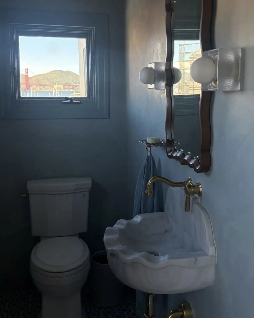 Soft blues, aged brass, and a window that steals the show.⁠
At Casa Way, even the powder room enjoys a view of the Golden Gate Bridge.⁠
⁠
#mareaclarkinteriors